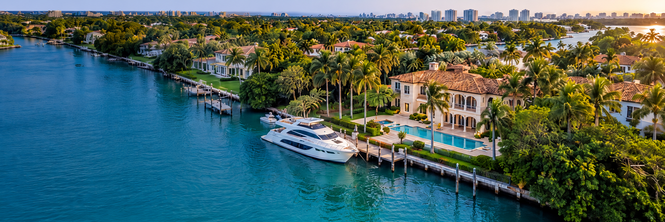 Conceptual Coral Gables waterfront estate rendering with dock and boat