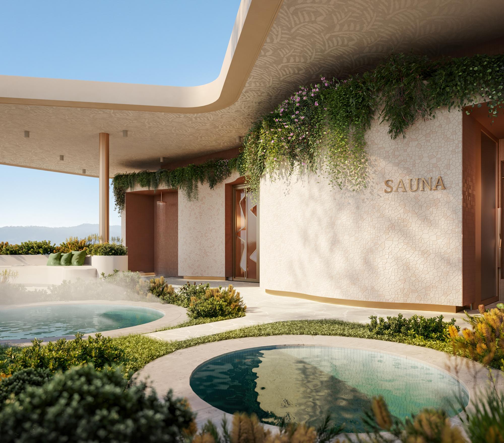 Landscaped outdoor sauna and hydrotherapy pools within a wellness-led residential community